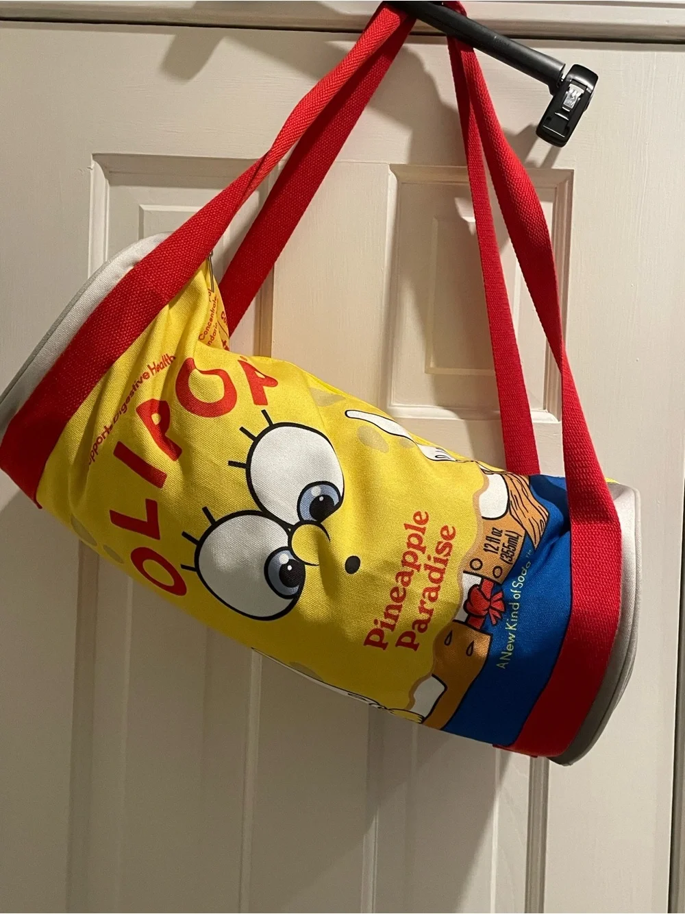 Olipop X SpongeBob Squarepants pineapple paradise cylinder duffle bag. 18”